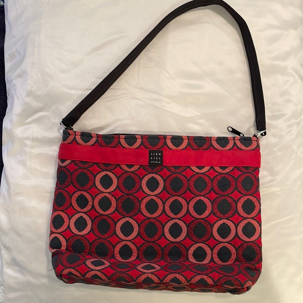 1154 Lill Studio. Cute fabric purse in red and black with shades of red.